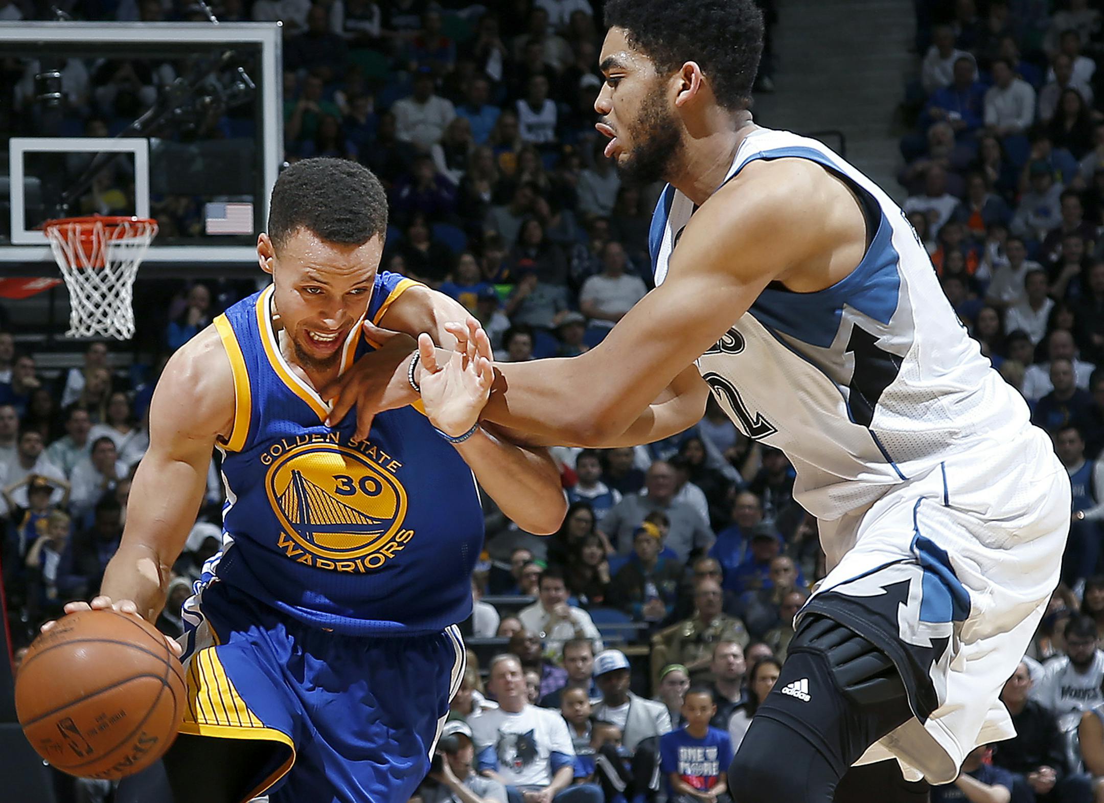 Wolves center Karl Anthony Towns, right, fouled Warriors guard Stephen Curry during a recent game.
