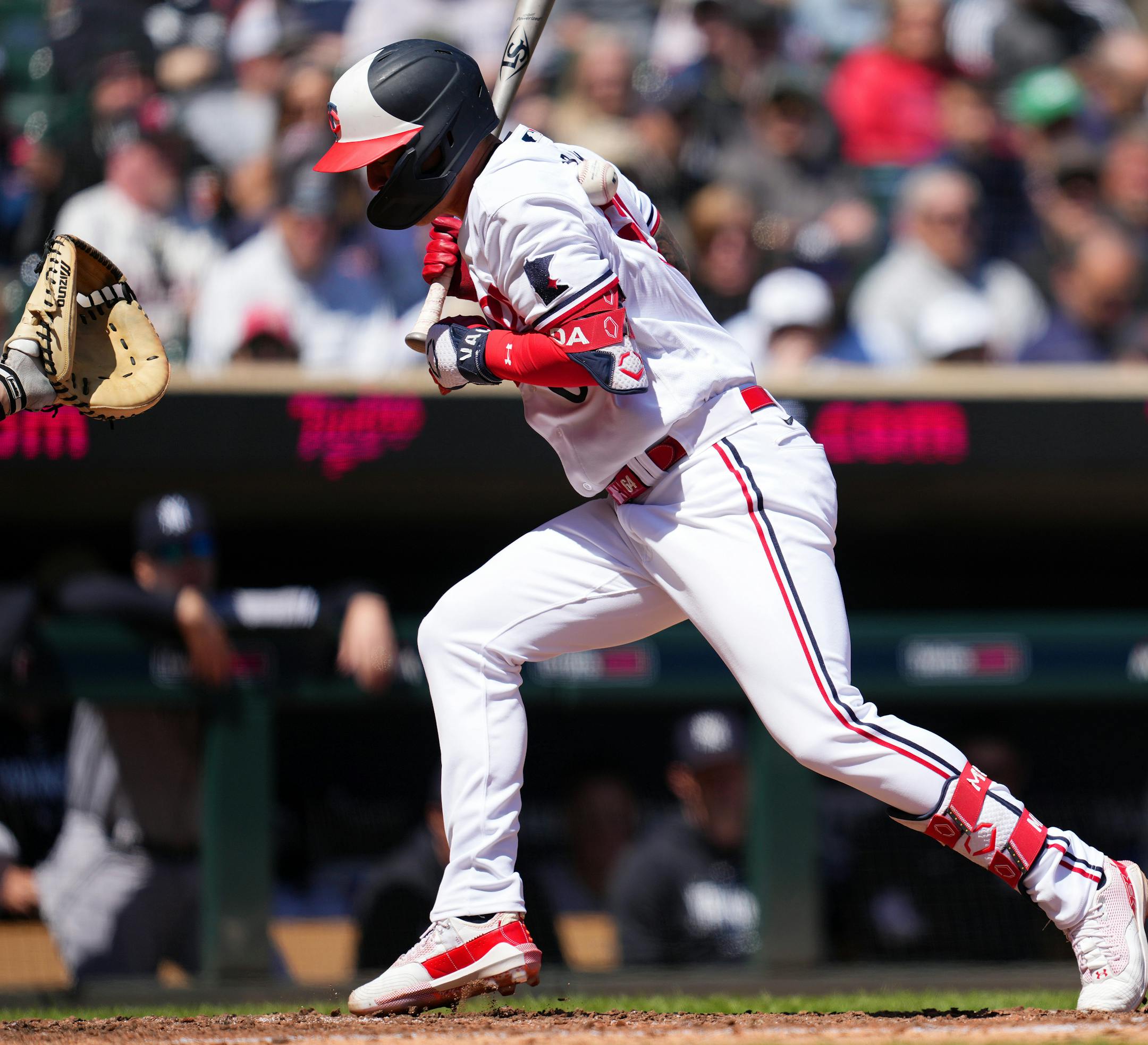 Minnesota Twins third baseman Jose Miranda (64) is hit with a pitch in the sixth inning.