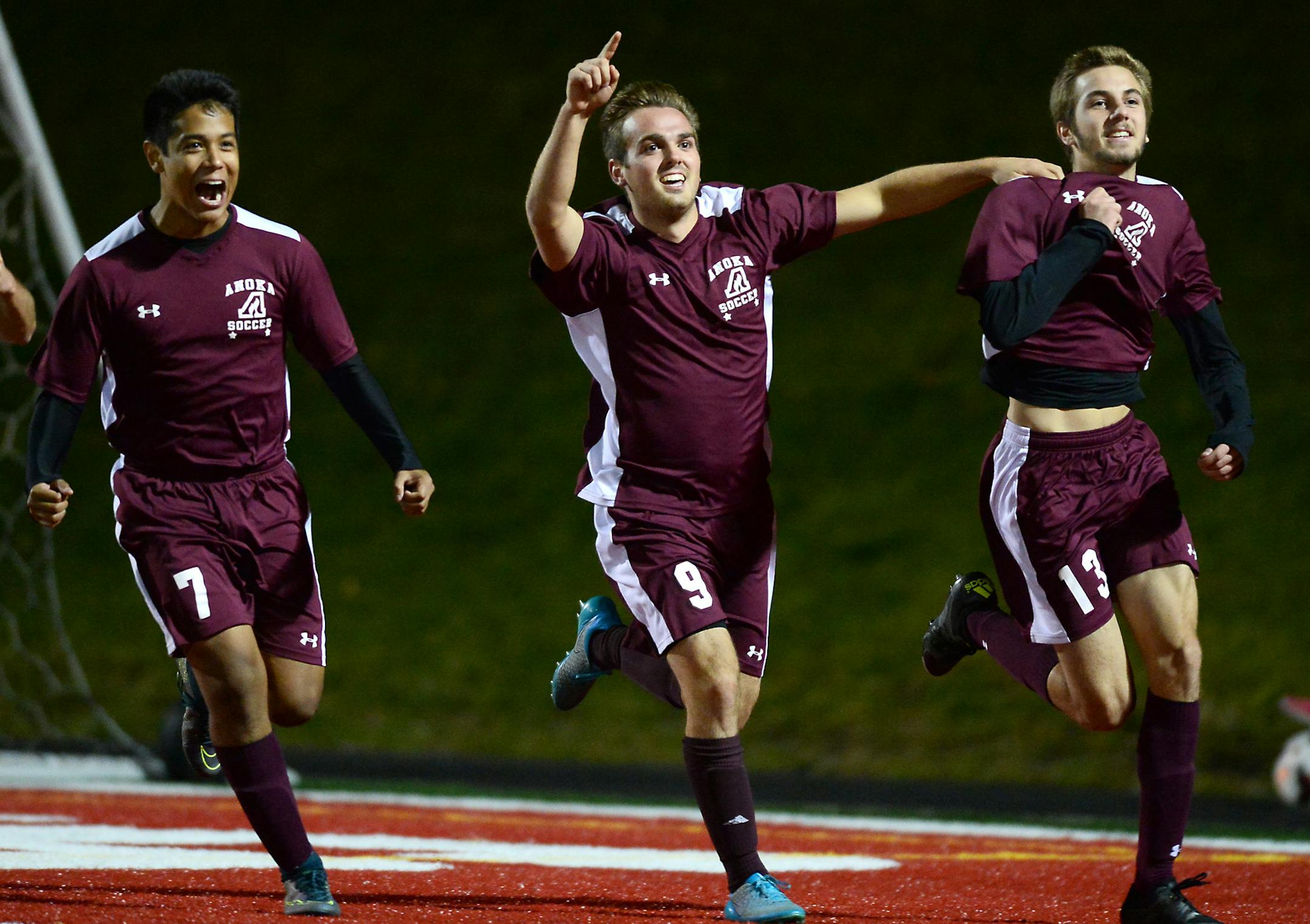 Anoka defender Miguel Martinez-Urrutia (7), defender Blake Neumann (9) and midfielder Donnie Guimont celebrated a goal scored by Guimont in the second half Thursday against East Ridge. ] (AARON LAVINSKY/STAR TRIBUNE) aaron.lavinsky@startribune.com Anoka played East Ridge in the boys' 2A state championship game on Thursday, Nov. 5, 2015 at Husky Stadium at St. Cloud State University. Anoka defeated East Ridge 2-1.