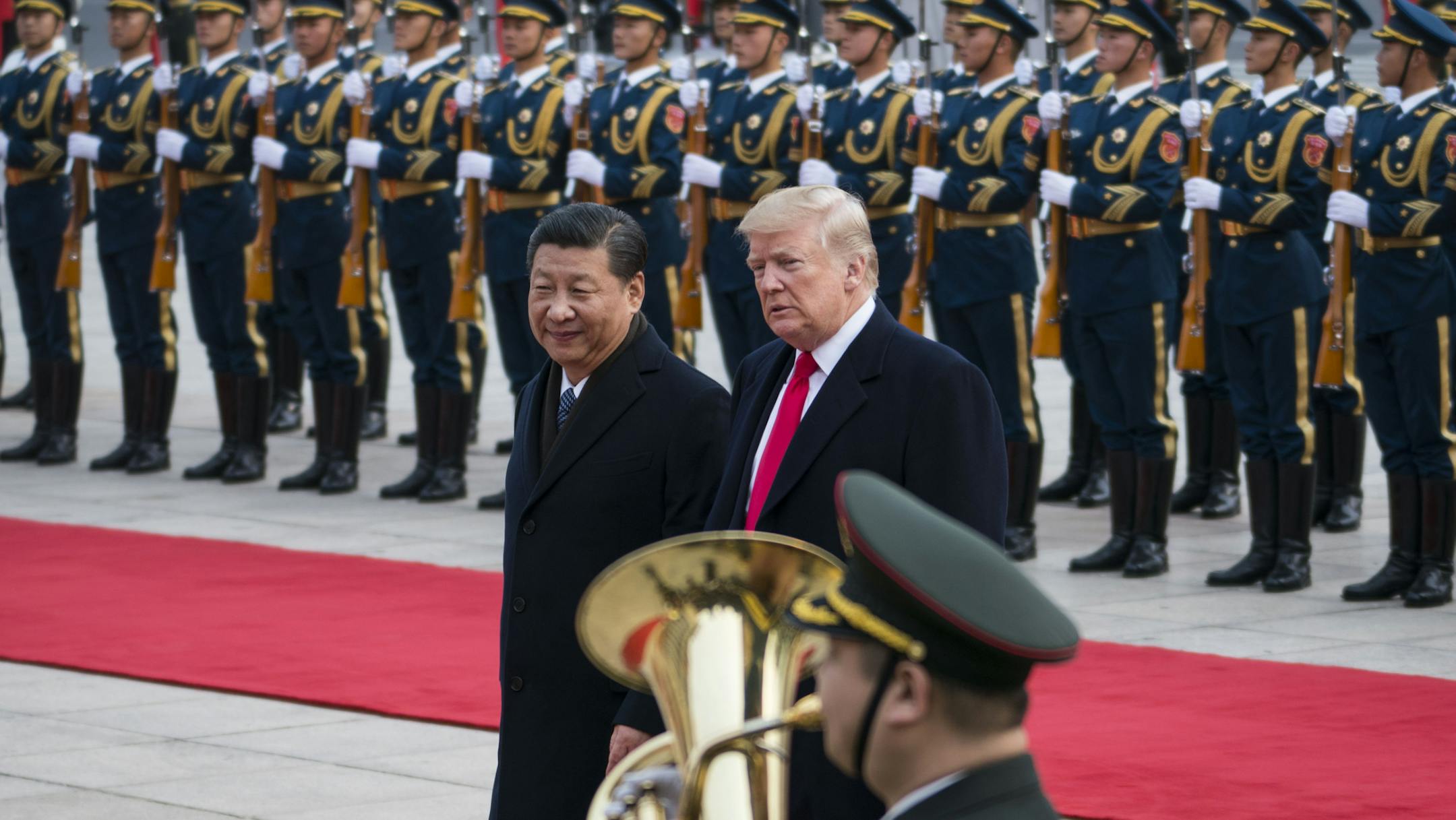 FILE -- President Donald Trump and President Xi Jinping of China at a welcome ceremony in Beijing, Nov. 9, 2017. Xi April 10, 2018, portrayed China as committed to opening its economy as he presented an alternative vision to Trump’s calls for tariffs and restricting trade with China, urging “dialogue rather than confrontation.” (Doug Mills/The New York Times)