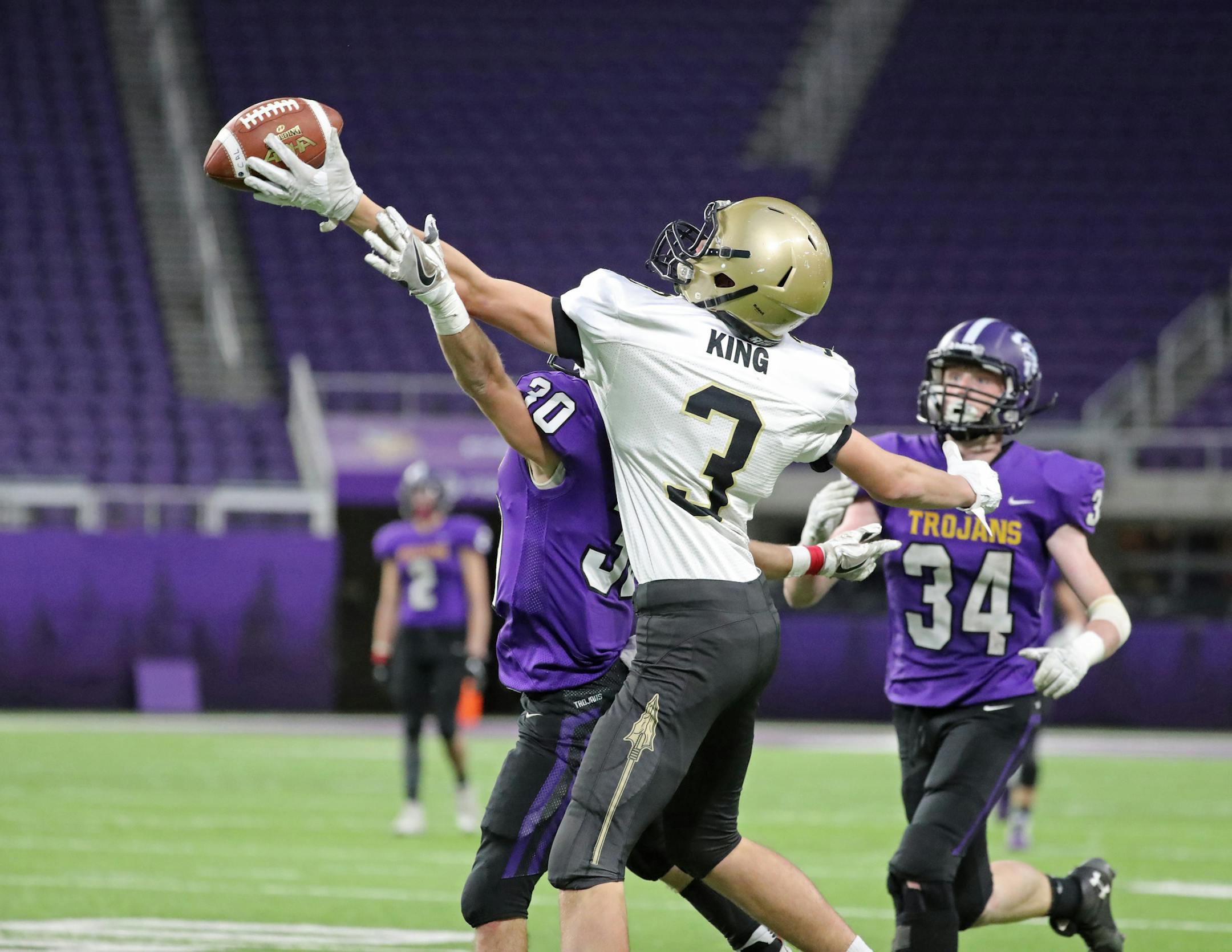 This incomplete pass intended for Caledonia's Eli King was defended by Barnesville's Chase Brenner (30) and Hunter Anderson (34). ] Shari L. Gross ï shari.gross@startribune.com Caledonia shut out Barnesville 21-0 for their fourth consecutive class 2A championship inside U.S. Bank Stadium on Friday, Nov. 23, 2018