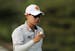 Jazz Janewattananond, of Thailand, reacts after putting on the 15th green during the third round of the PGA Championship golf tournament, Saturday, Ma