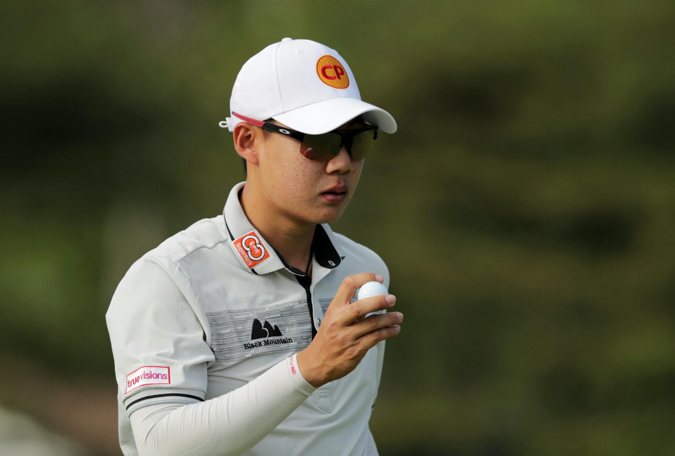 Jazz Janewattananond, of Thailand, reacts after putting on the 15th green during the third round of the PGA Championship golf tournament, Saturday, May 18, 2019, at Bethpage Black in Farmingdale, N.Y.
