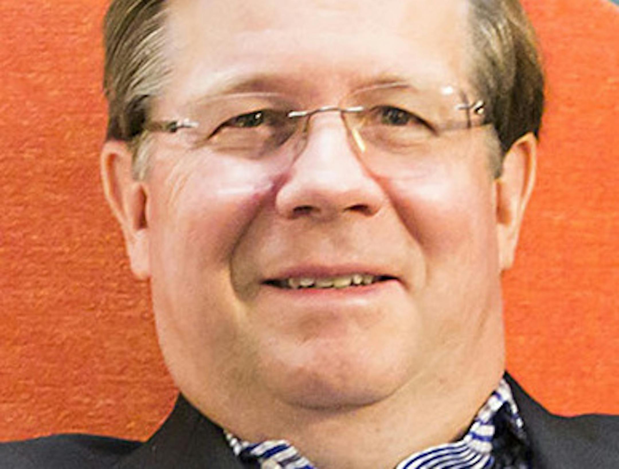 Jim Lentz, CEO of Toyota North America, stretches out in a model lounge area at Toyota's temporary headquarters on Wednesday, July 22, 2015, in Plano, Texas. Several furniture suppliers are bidding for contracts on the Toyota's new campus and have set up model work spaces at the company's temporary quarters on Legacy Drive. (Smiley N. Pool/The Dallas Morning News/TNS) ORG XMIT: 1172020
