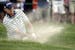 Steve Stricker hits out of a bunker on the fourth hole during the fourth round of the U.S. Open golf tournament at Merion Golf Club, Sunday, June 16, 