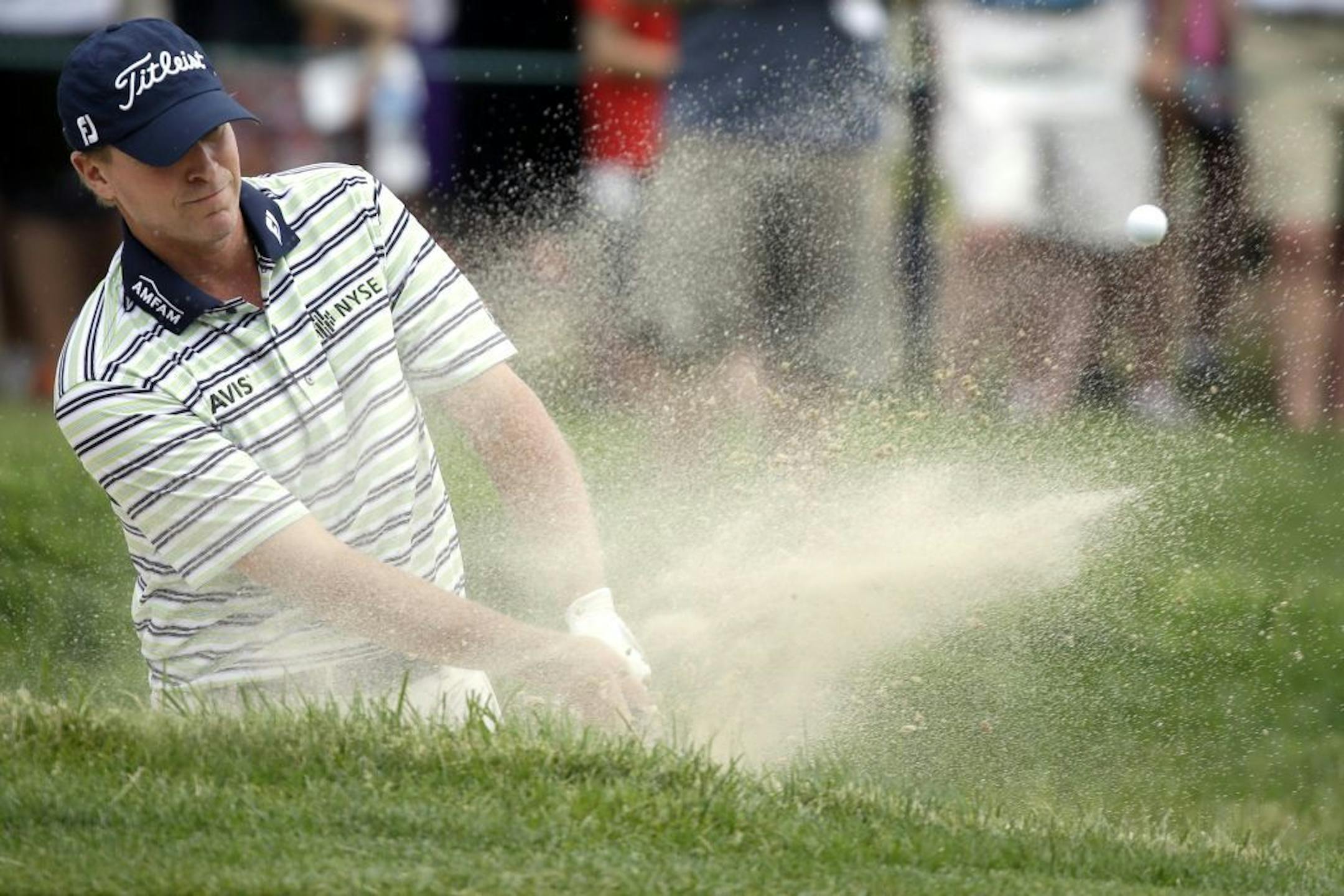 Steve Stricker hits out of a bunker on the fourth hole during the fourth round of the U.S. Open golf tournament at Merion Golf Club, Sunday, June 16, 2013, in Ardmore, Pa.