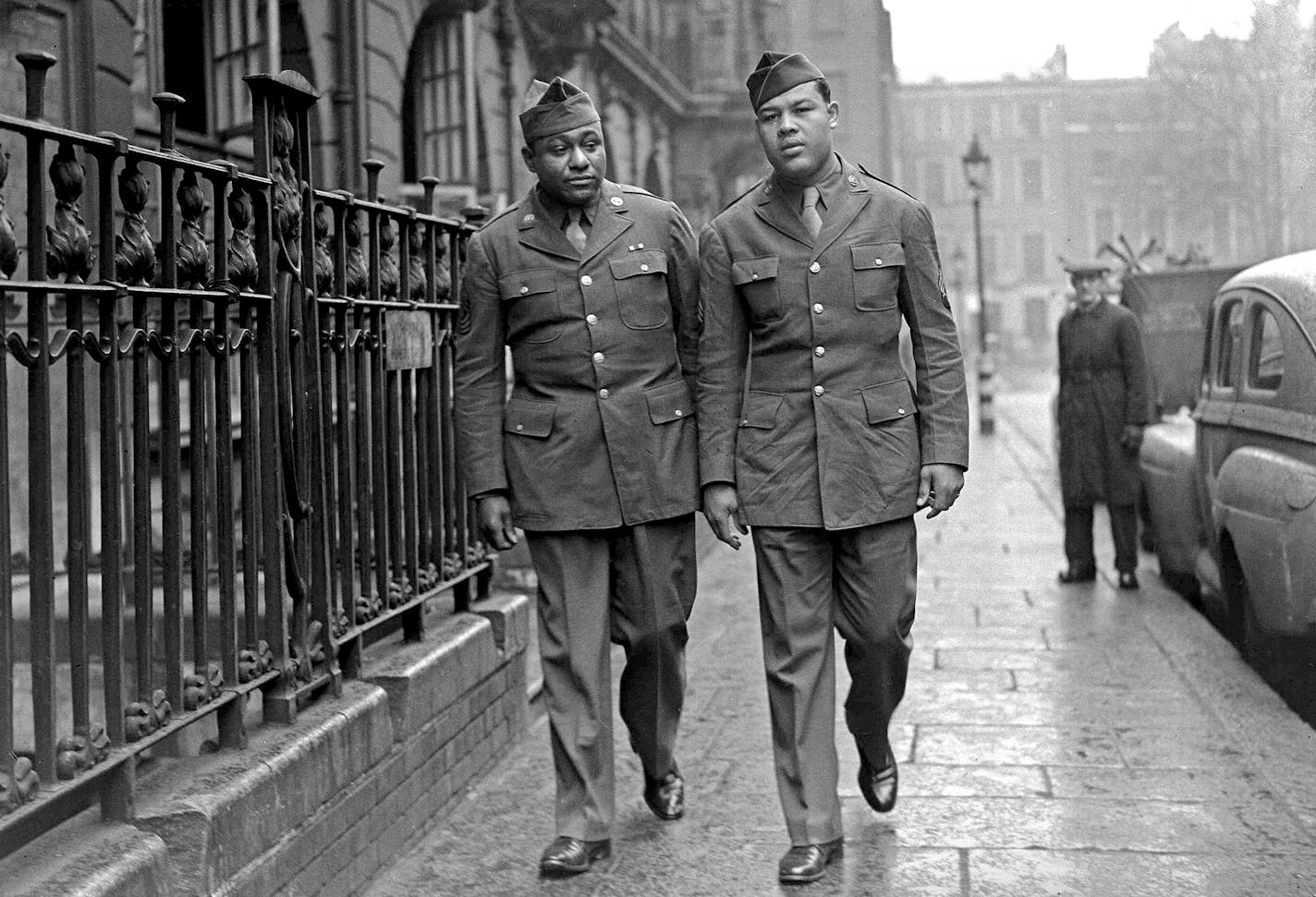 11th April 1944, Joe Louis (right) with his sparring partner, first Sergeant George Nicholson of New York City pictured in London