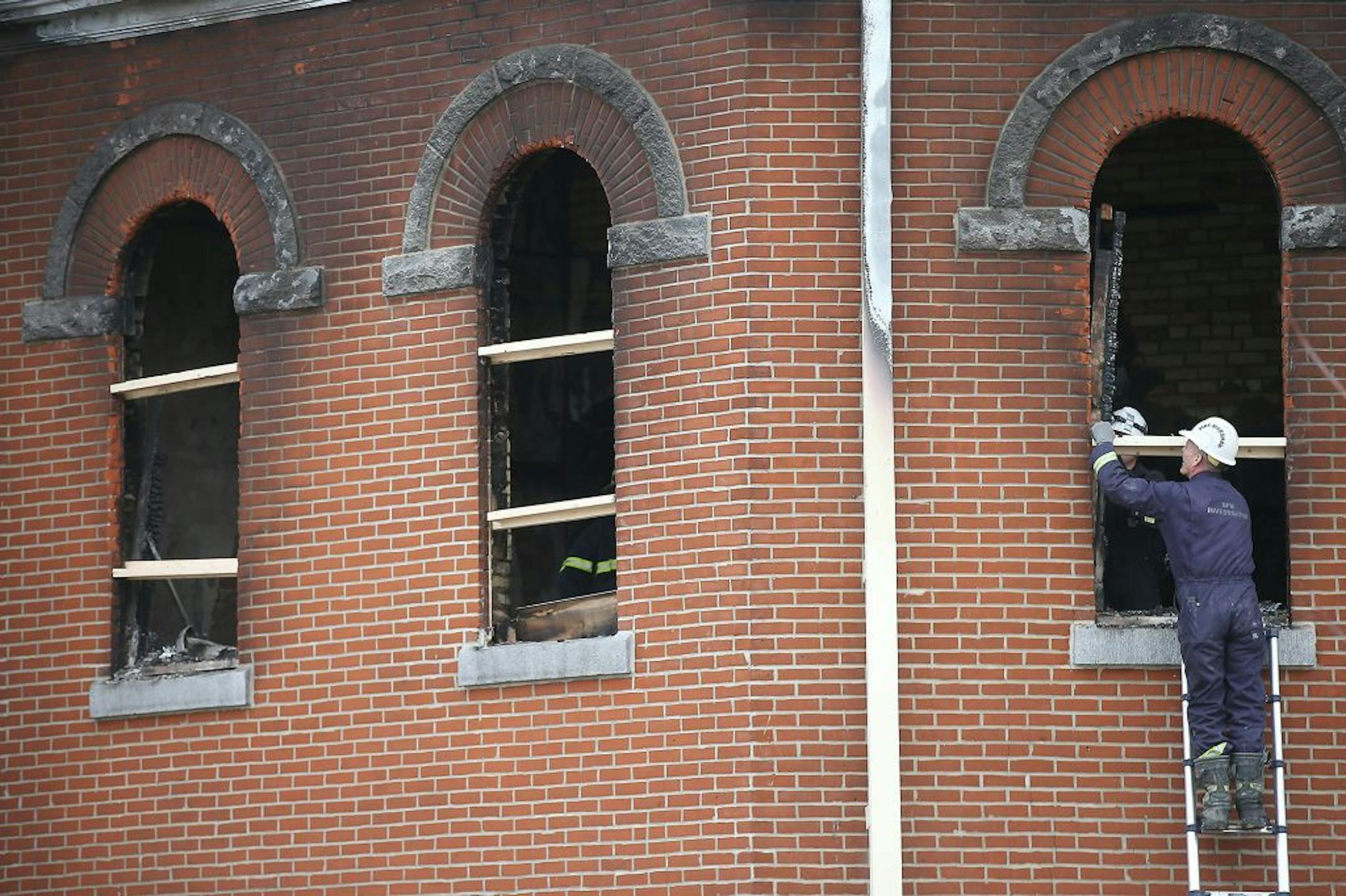 Local fire and federal agents arrived to inspect the scene where a fire damaged about 30 percent of the 120-year-old St. Mary's Catholic Church, Monday, March 14, 2016 in Melrose, MN.