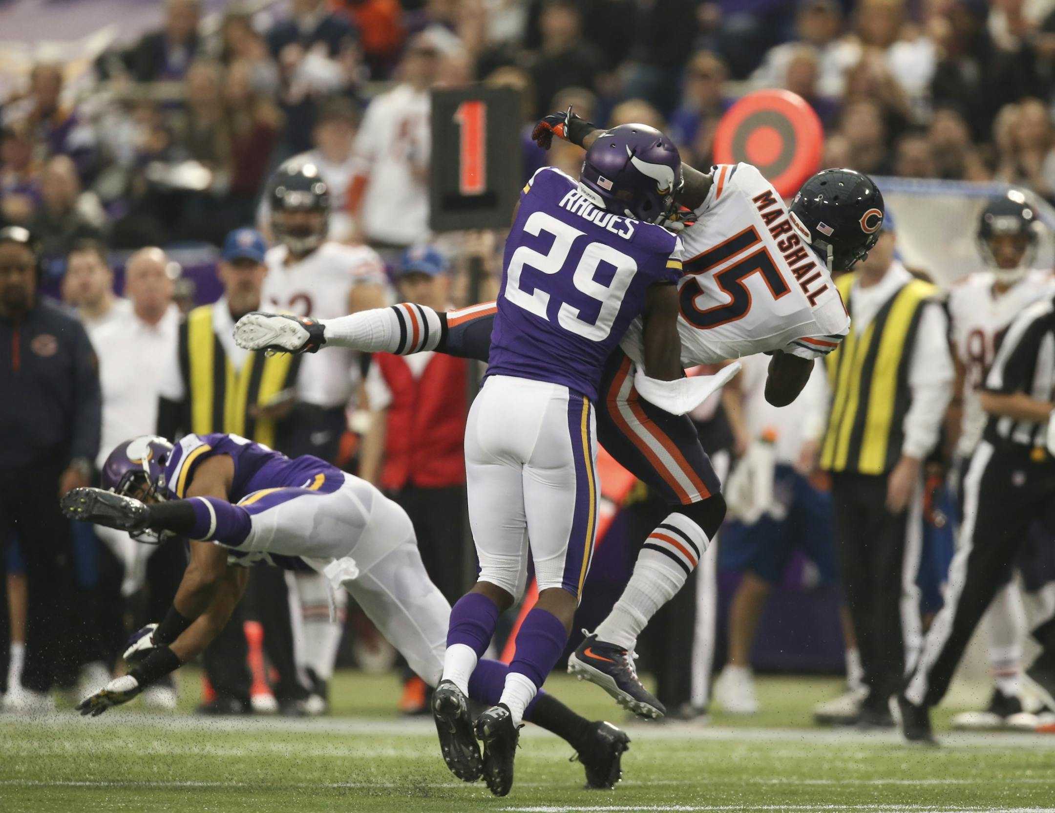 The Minnesota Vikings eeked out a 23-20 overtime win over the Chicago Bears in an NFL football game Sunday afternoon, December 1, 2013 and Mall of America Field in Minneapolis. Minnesota Vikings cornerback Xavier Rhodes (29) tackled Chicago Bears wide receiver Brandon Marshall (15) after he gained 15 yards in the second quarter.