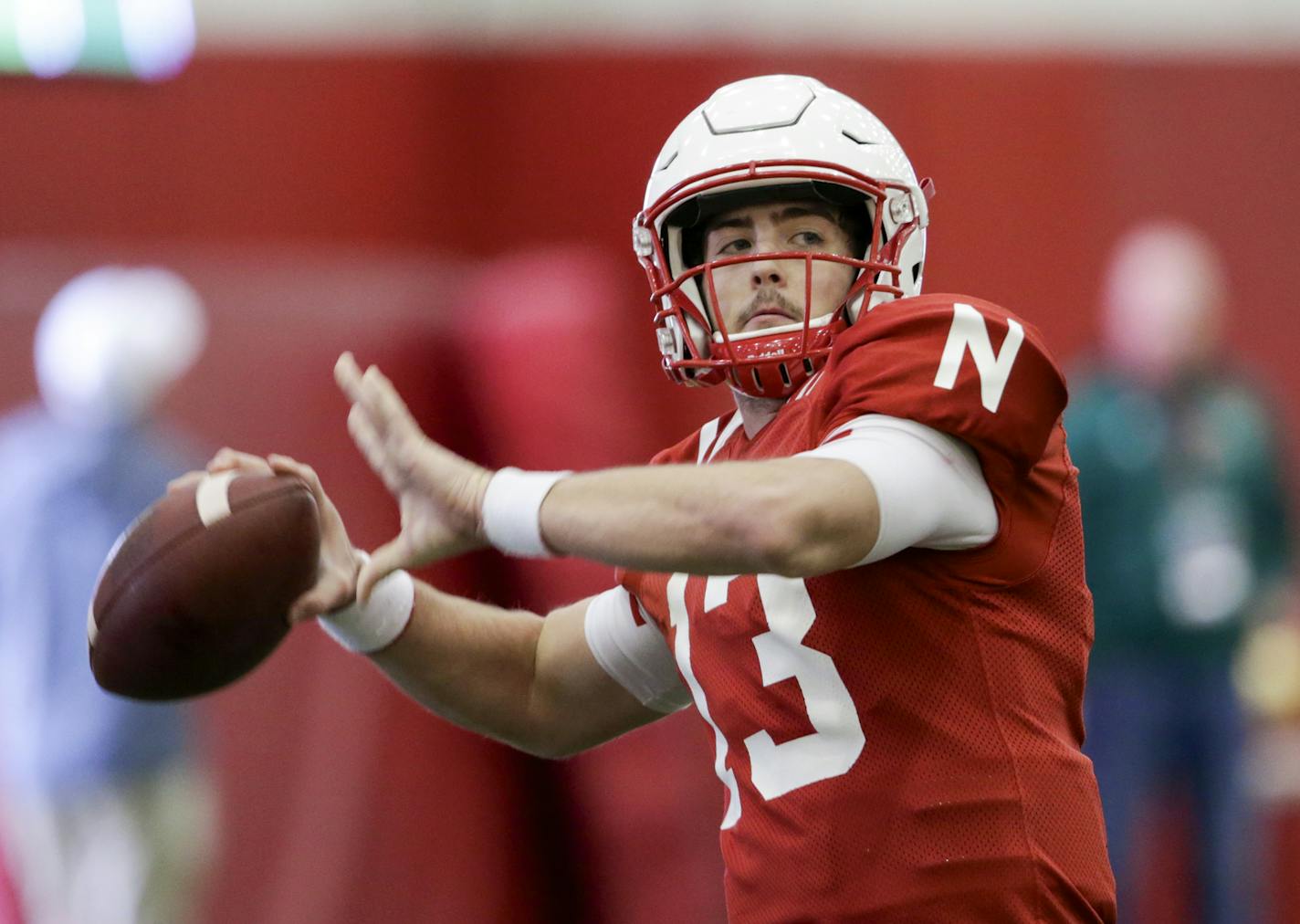 FILE - In this March 11, 2017, file photo, Nebraska quarterback Tanner Lee (13) throws during NCAA college football spring practice in Lincoln, Neb. After two mediocre years at Tulane and sitting out 2016 because of transfer rules, Lee is the starting quarterback at Nebraska. (AP Photo/Nati Harnik, File)