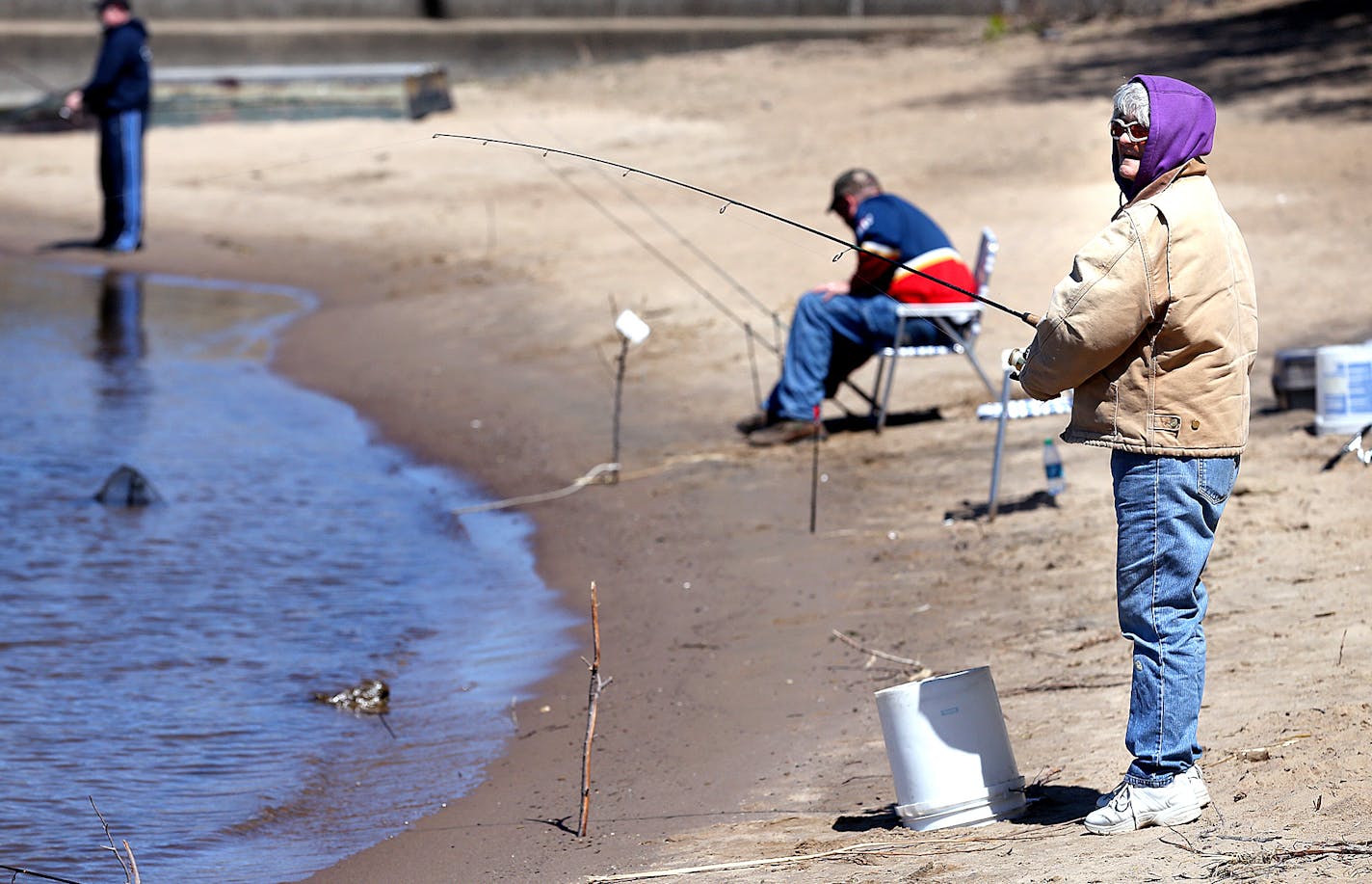 Debbie Boecher of rural Viroqua fishes the Mississippi River on a beech below the lock and dam in Genoa. Boecher has been fishing at the beach that can only be accessed by crossing railroad tracks by foot for 20 years. Peter Thomson, La Crosse Tribune