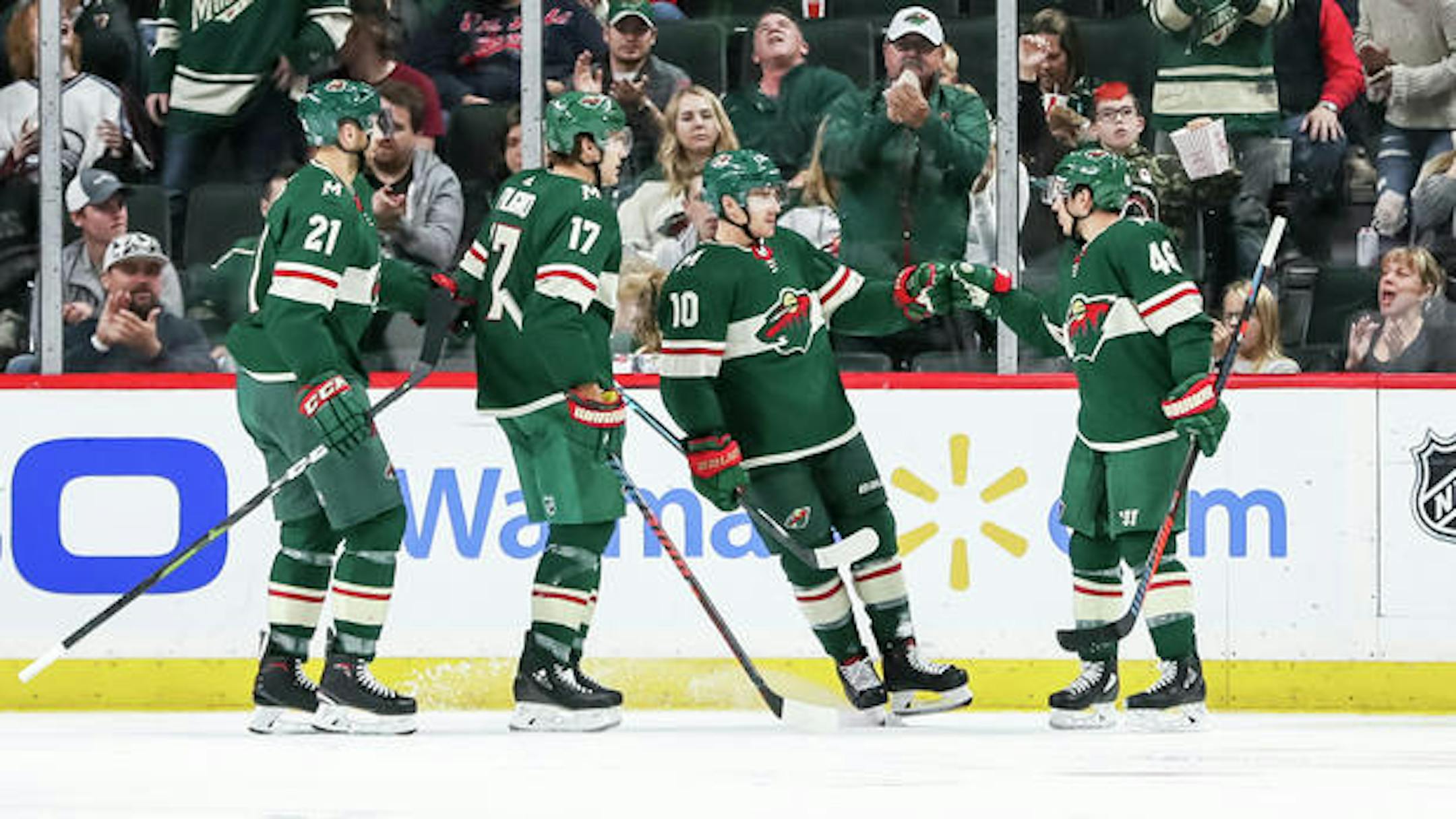 Sep 22, 2018; Saint Paul, MN, USA; Minnesota Wild forward Matt Read (10) celebrates his goal with teammates during the second period against Colorado Avalanche at Xcel Energy Center. Mandatory Credit: Brace Hemmelgarn-USA TODAY Sports