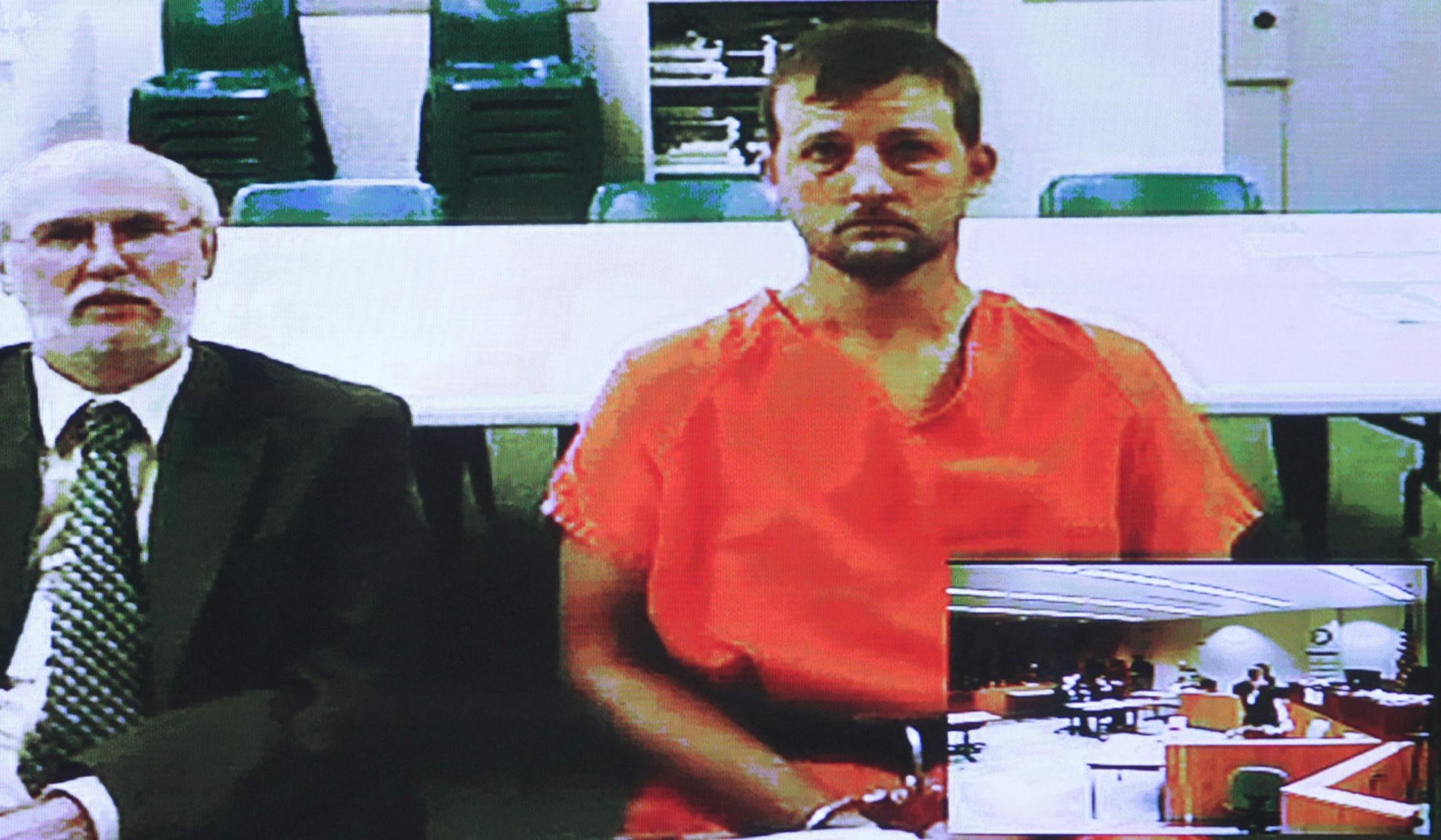 Aaron Schaffhausen, 34, right, is accused of slashing the throats of his children. He made his first court appearance Thursday via a video feed from jail but said little until prodded to speak for himself. At left is Schaffhausen's attorney, public defender John Kucinski,