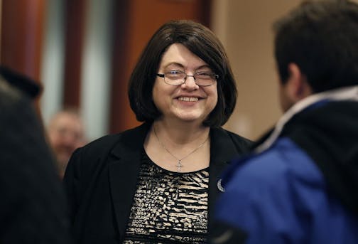 Barbara Marschall was greeted with hugs by other commissioners and community members during a farewell party for her at the Scott County Government Center, Wednesday, December 21, 2016 in Shakopee, MN.