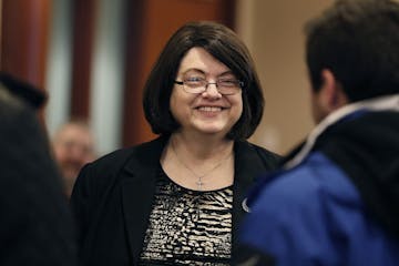 Barbara Marschall was greeted with hugs by other commissioners and community members during a farewell party for her at the Scott County Government Ce