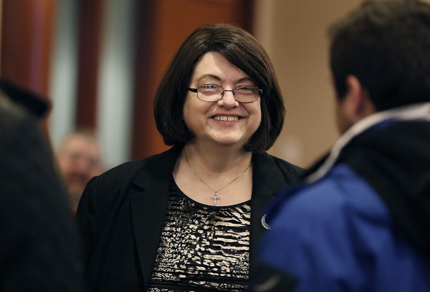 Barbara Marschall was greeted with hugs by other commissioners and community members during a farewell party for her at the Scott County Government Center, Wednesday, December 21, 2016 in Shakopee, MN.