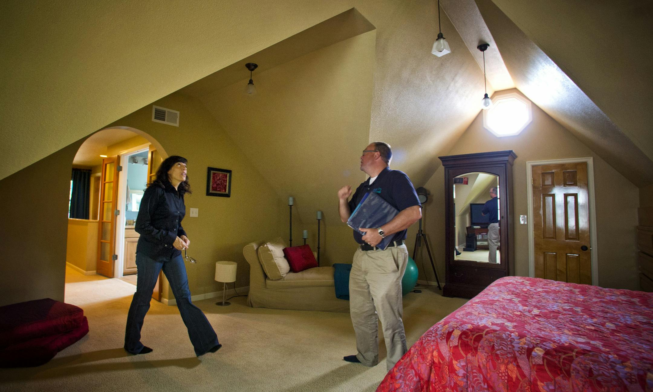 Frank Parsons, property manager from 33rd Company did an initial walk through with Tracy Wilborn in her Minneapolis home. She is deciding between selling her home or hiring 33rd Company to act as property manager and turn it into a rental property. Thursday, May 30, 2013 ] GLEN STUBBE * gstubbe@startribune.com