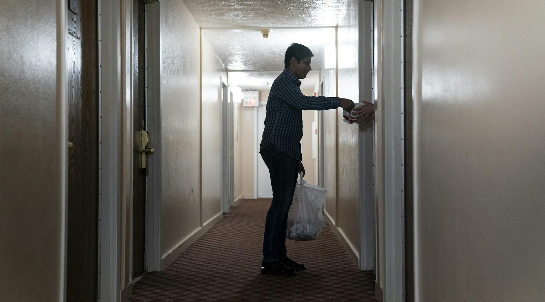 Zahid Memood dropped off Chick-fil-A for homeless people residing at the Chaska Super 8. He was helping out his sister Sana Cheema who is the general manager of the hotel in Chaska, Minn., on Friday, May 15, 2020. ] RENEE JONES SCHNEIDER ¥ renee.jones@startribune.com