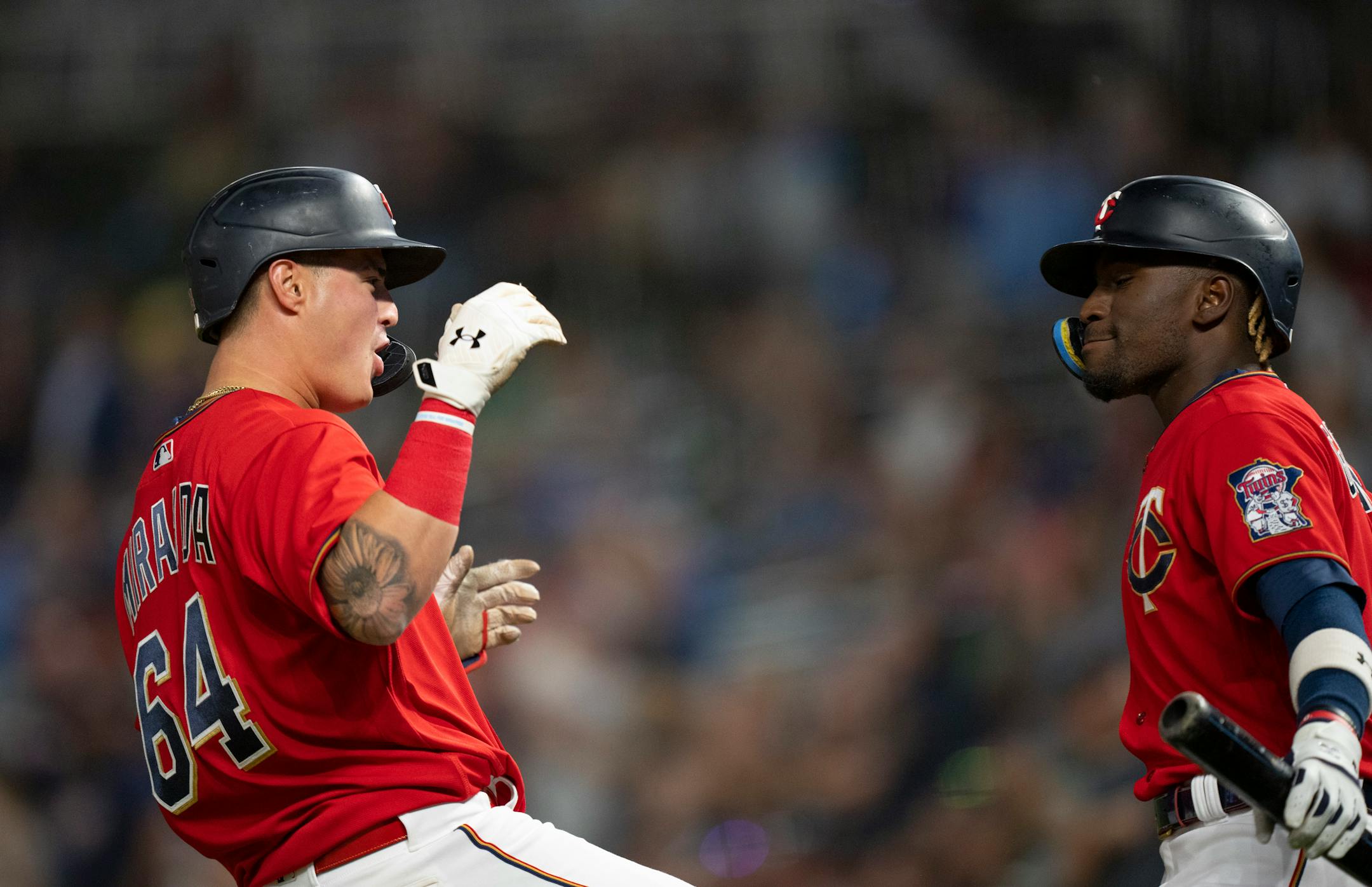 The Twins' Jose Miranda (64) was congratulated by Nick Gordon after his solo homer in the fifth inning.