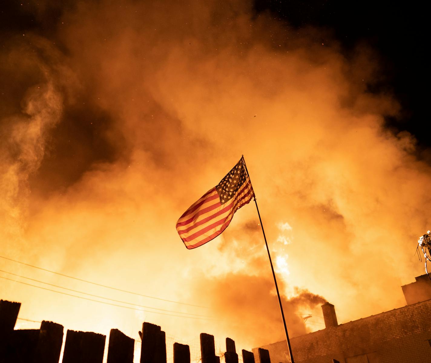 Neighbors fought with garden hoses and buckets to save homes after rioters set fire to a multi-story affordable housing complex under construction near the Third Precinct. ] MARK VANCLEAVE ¥ Protester and police clashed violently in South Minneapolis as looters attacked business on Lake Street on Wednesday, May 27, 2020 in Minneapolis. The protests were sparked by the death of George Floyd at the hands of a Minneapolis Police officer Monday.