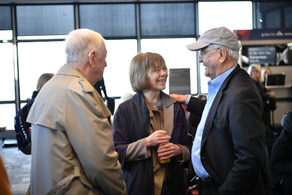 Tina Smith greeted former Vice President Walter Mondale at MSP Airport on the way to D.C. for her swearing in. On the left is Smith's father.