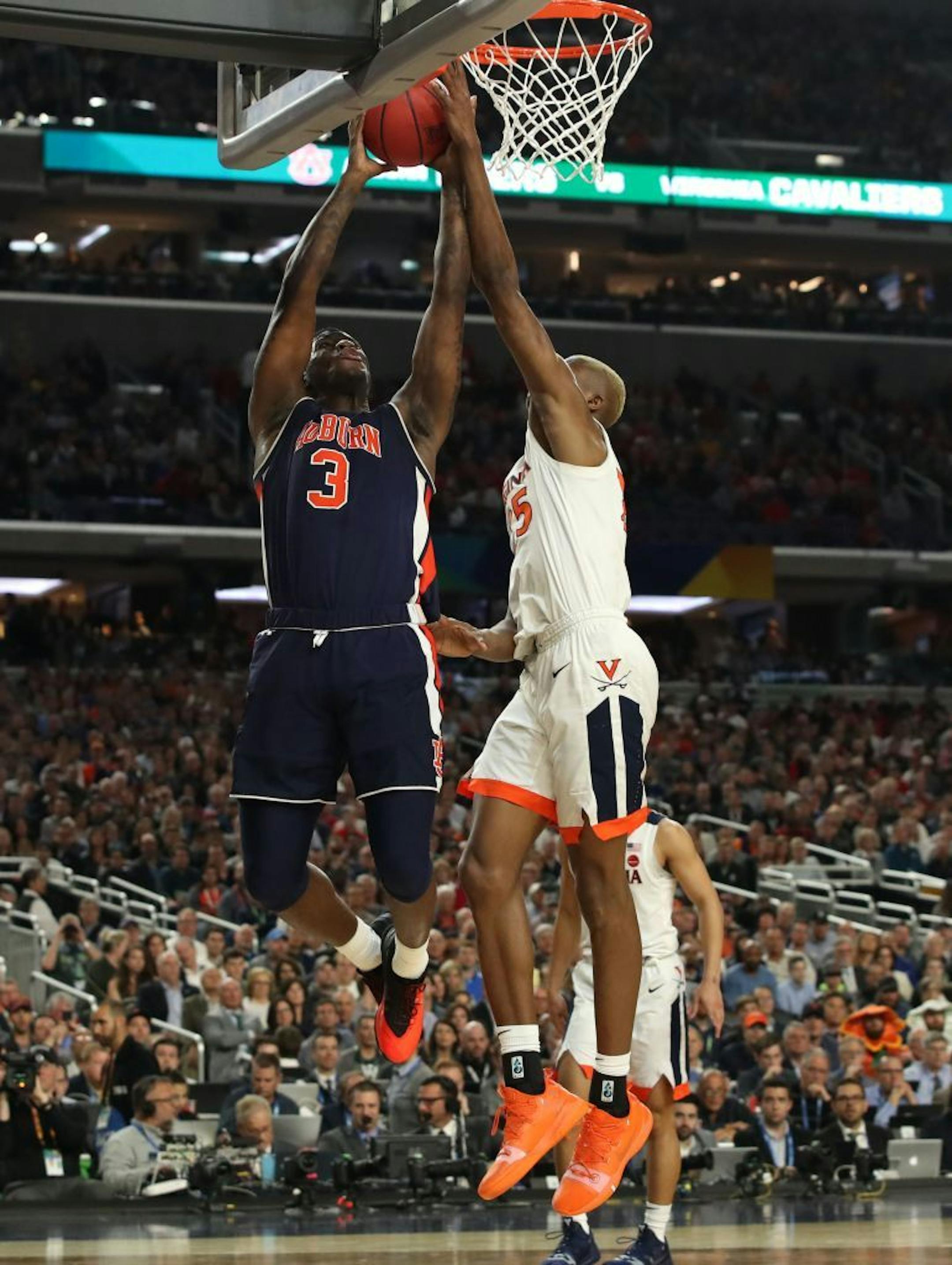 Virginia Cavaliers forward Mamadi Diakite (25) blocked Auburn forward Danjel Purifoy (3) during the second half.