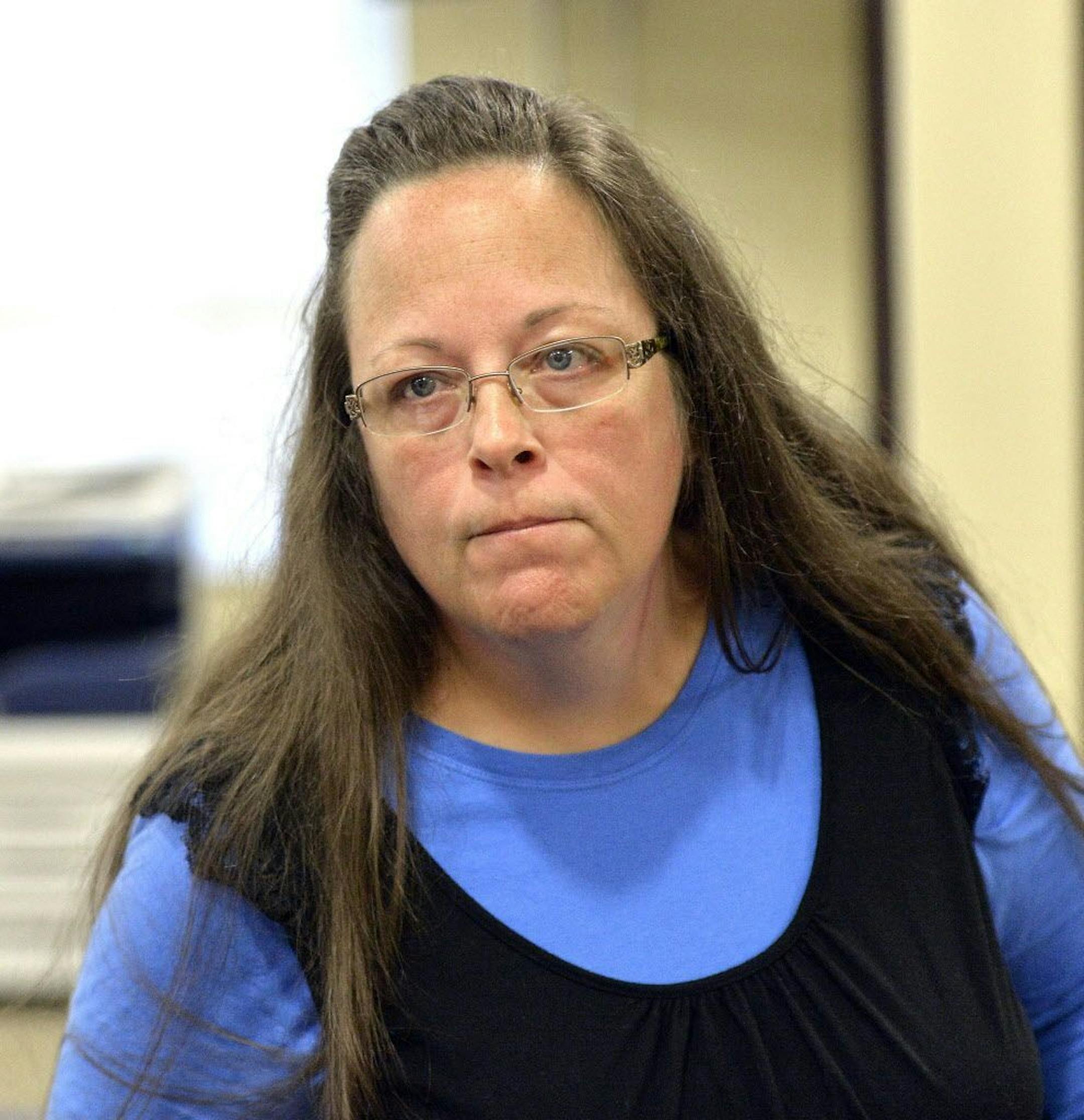 Rowan County Clerk Kim Davis listens to a customer following her office's refusal to issue marriage licenses at the Rowan County Courthouse in Morehead, Ky., Tuesday, Sept. 1, 2015. Although her appeal to the U.S. Supreme Court was denied, Davis still refuses to issue marriage licenses.
