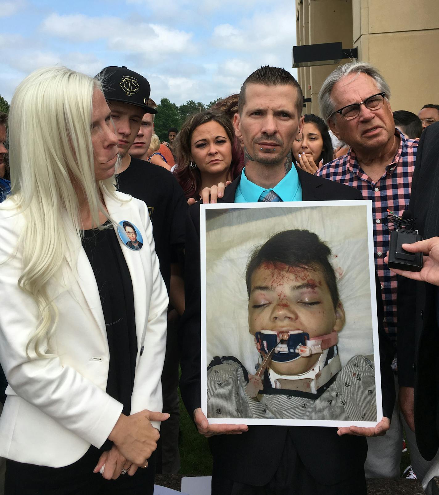 Photo of Antonio DeMueles held by his father Jeffrey DeMueles and his aunt Sheila Potocnik. Credit: