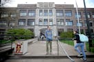 Roosevelt High School Principal Michael Bradley greeted students as they made their way into school, Friday, April 29, 2016 in Minneapolis, MN. Bradle