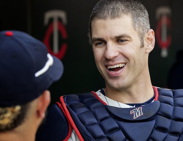 Minnesota Twins Joe Mauer was greeted by teammates after catching one pitch in the ninth inning. ] CARLOS GONZALEZ &#xef; cgonzalez@startribune.com &#