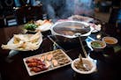 Little Szechuan's Hot Pot with sirloin beef slices, lamb slices, luncheon meat, shrimp, mussels, clams, fish tofu, Chinese cabbage, watercress, yams, 