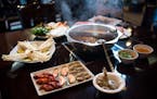 Little Szechuan's Hot Pot with sirloin beef slices, lamb slices, luncheon meat, shrimp, mussels, clams, fish tofu, Chinese cabbage, watercress, yams, 
