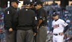 Minnesota Twins manager Paul Molitor waited while umpires discussed a ruling on a ball hit by the Twins' Brian Dozier in the first inning Monday night