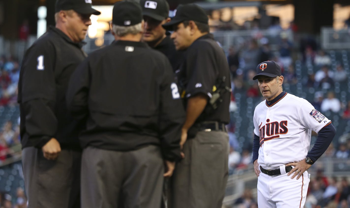 Minnesota Twins manager Paul Molitor waited while umpires discussed a ruling on a ball hit by the Twins' Brian Dozier in the first inning Monday night. The ball was initially ruled foul, but after Molitor's protest, was changed to a double. ] JEFF WHEELER &#x2022; jeff.wheeler@startribune.com The Minnesota Twins faced the Detroit Tigers in an MLB baseball game Monday night, April 27, 2015 at Target Field in Minneapolis.