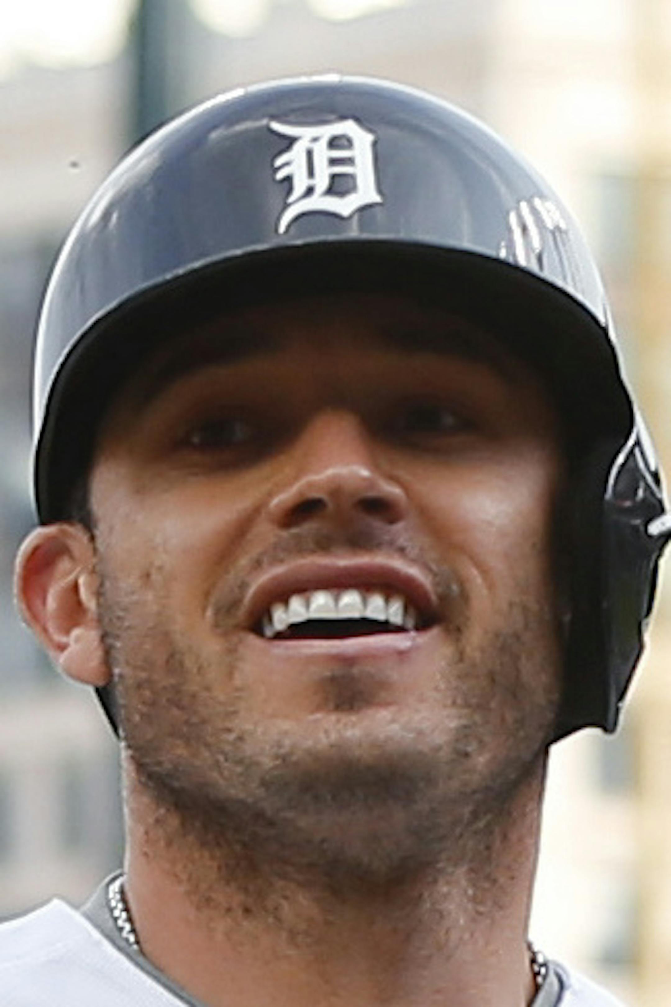 Detroit Tigers' Ian Kinsler, left, is congratulated by J.D. Martinez (28) after hitting a solo home run against the Minnesota Twins in the first inning of a baseball game Monday, May 16, 2016 in Detroit. (AP Photo/Paul Sancya)