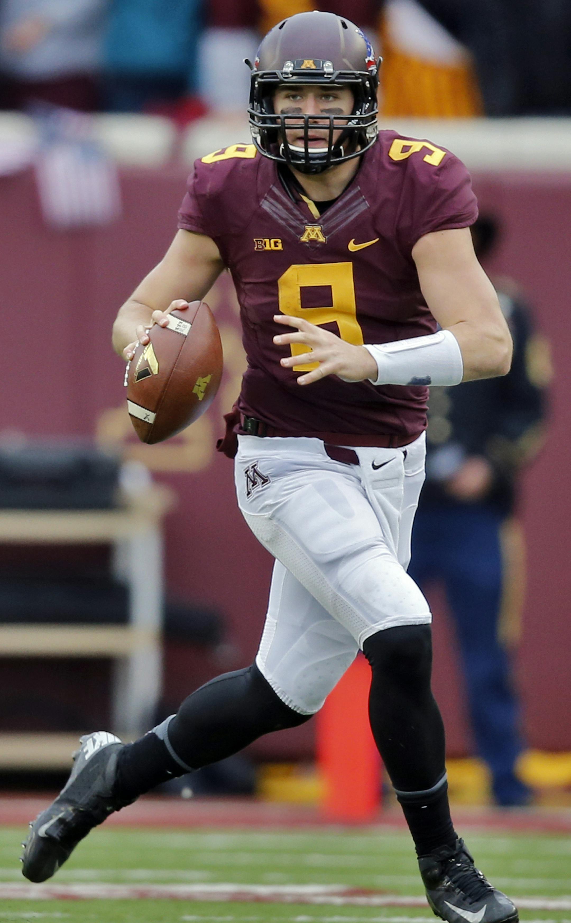 Minnesota Gophers vs. Penn State. Minnesota won 24-10. Minnesota quarterback Philip Nelson looked for a receiver downfield as he rolled out of the pocket. (MARLIN LEVISON/STARTRIBUNE(mlevison@startribune.com) ORG XMIT: MIN1311091644269900