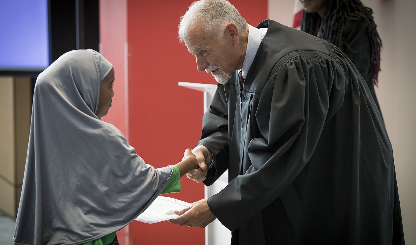 U.S. Magistrate Judge David T. Schultz, District of Minnesota, presented Certificates of Citizenship to 23 children during a U.S. Citizenship and Immigration Services citizenship ceremony at the Minnesota Children's Museum, Friday, July 21, 2017 in St. Paul, MN. ] ELIZABETH FLORES &#xef; liz.flores@startribune.com