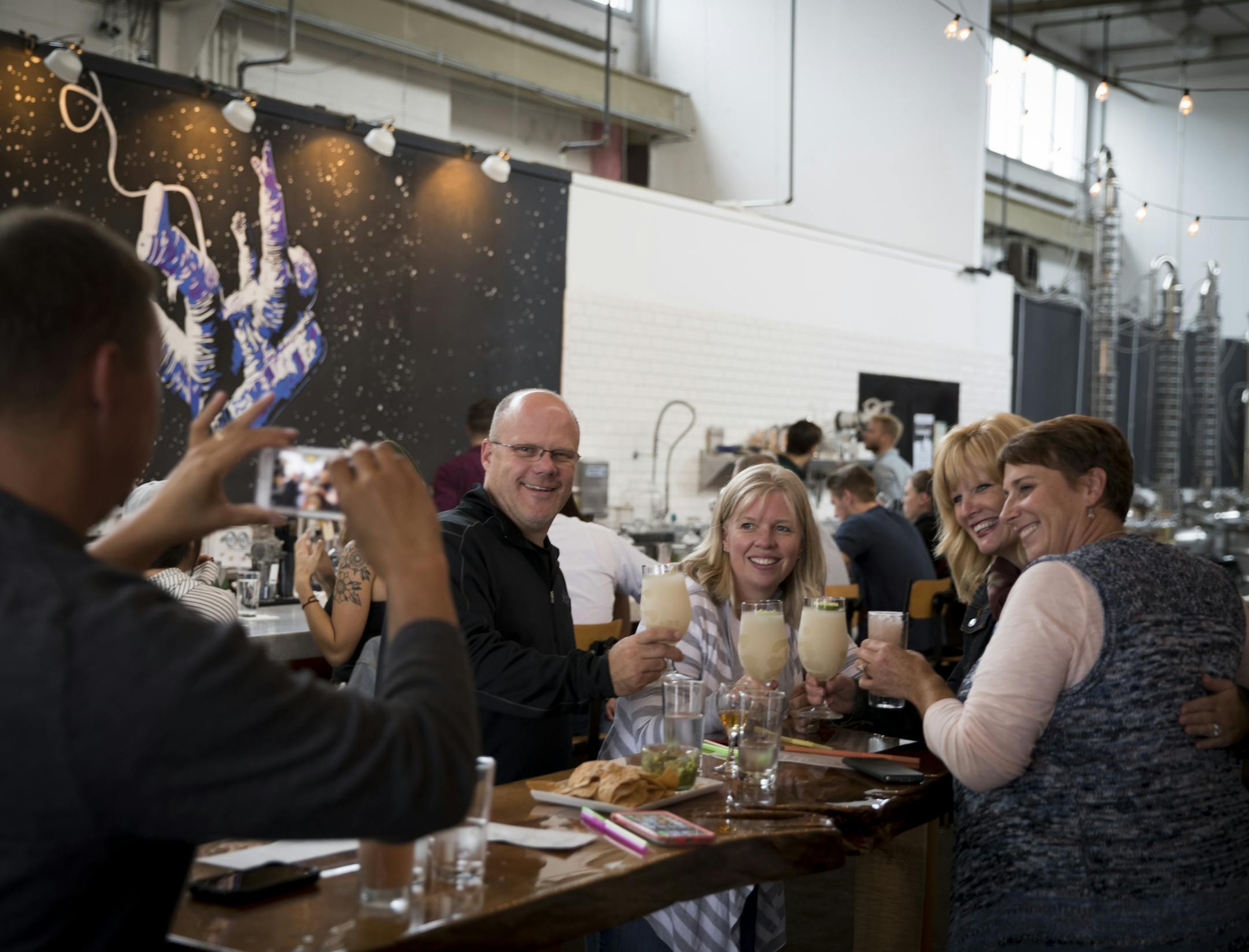 A picture-perfect night on the town: Aaron Johnston snapped a photo of Bill Hoppenrath, Tina Johnston, Julie Burgoyne and Jackie Hoppenrath with their Mai Tais at Norseman Distillery in Minneapolis.