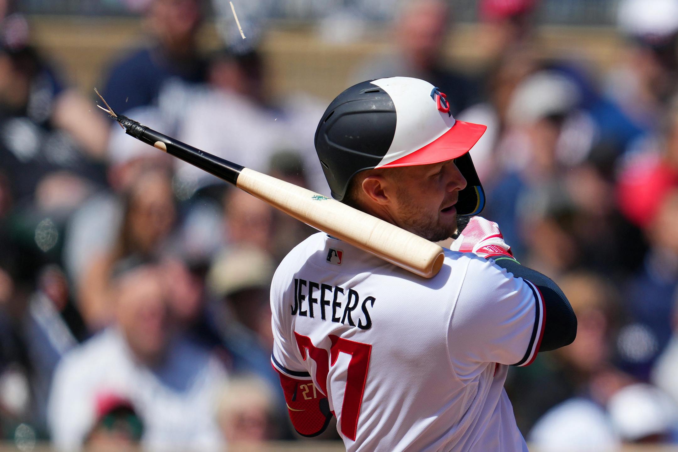 Minnesota Twins catcher Ryan Jeffers (27) breaks a bat in the seventh inning.