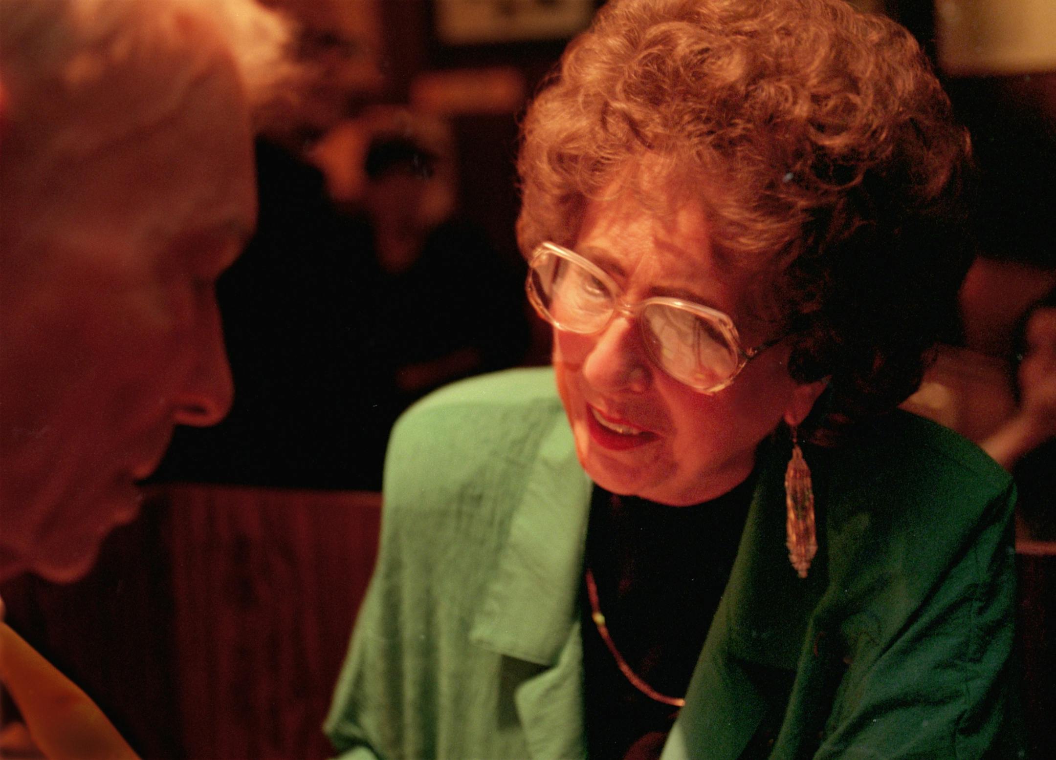 Taste East Hennepin Neighborhood story on the eating establishments. -- Evie Radke, quite possibly the Twin Cities' most gracious hostess, presides over the dining room at Nye's with polished authority. Evie talks with long time friend Al Ophus, 86 year-old drummer of the Ruth Adams most dangerous Polka Band.