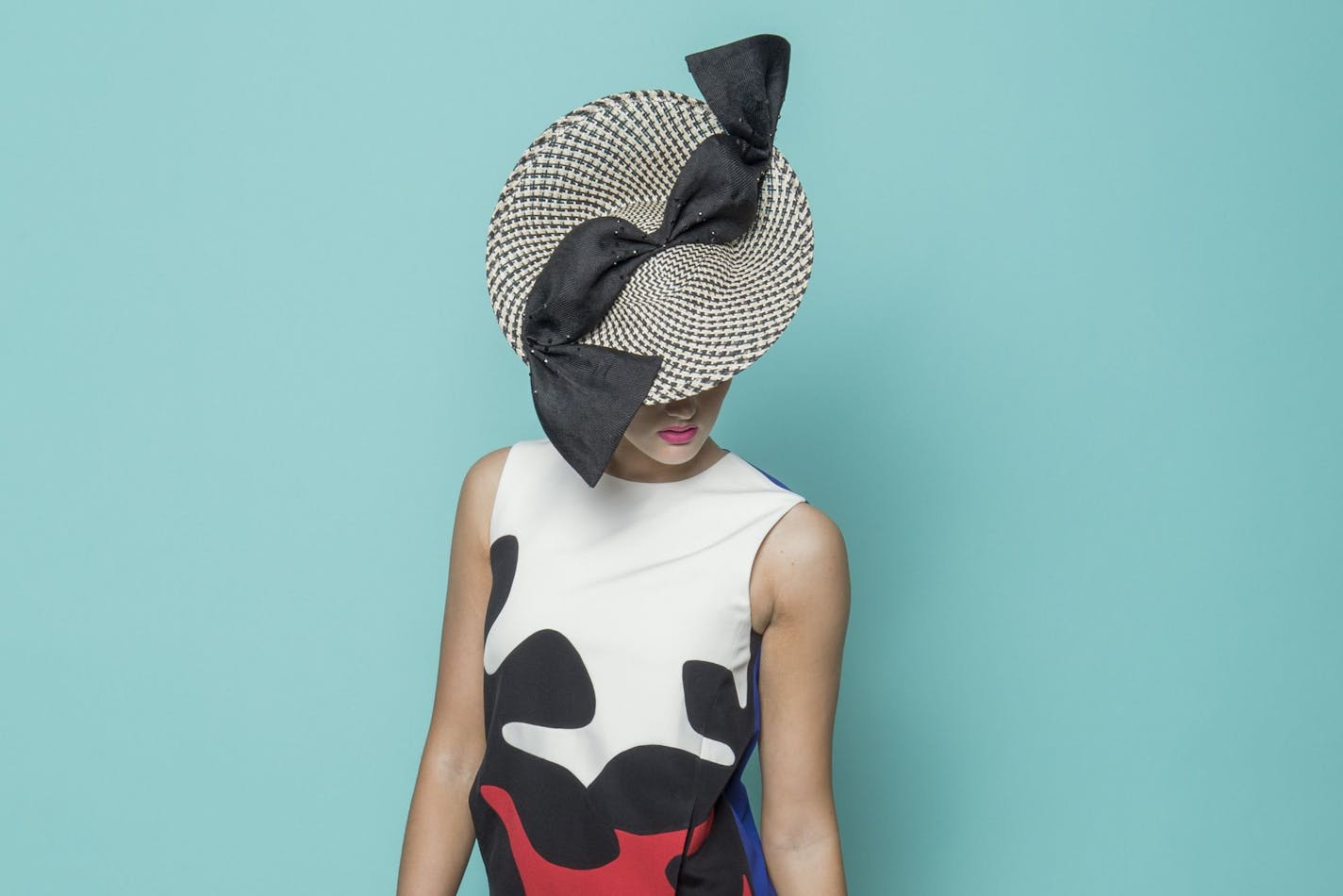 Headpiece by Minneapolis-based Karen Morris Millinery.