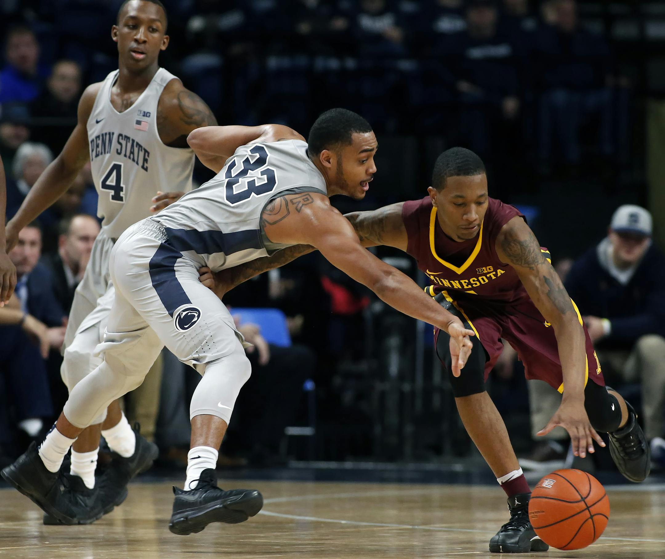 Penn State's Shepp Garner (33) goes for the steal on Minnesota's Deividas Zemgulis (1) during the first half of an NCAA college basketball game in State College, Pa., Saturday, Jan. 14, 2017. (AP Photo/Chris Knight)