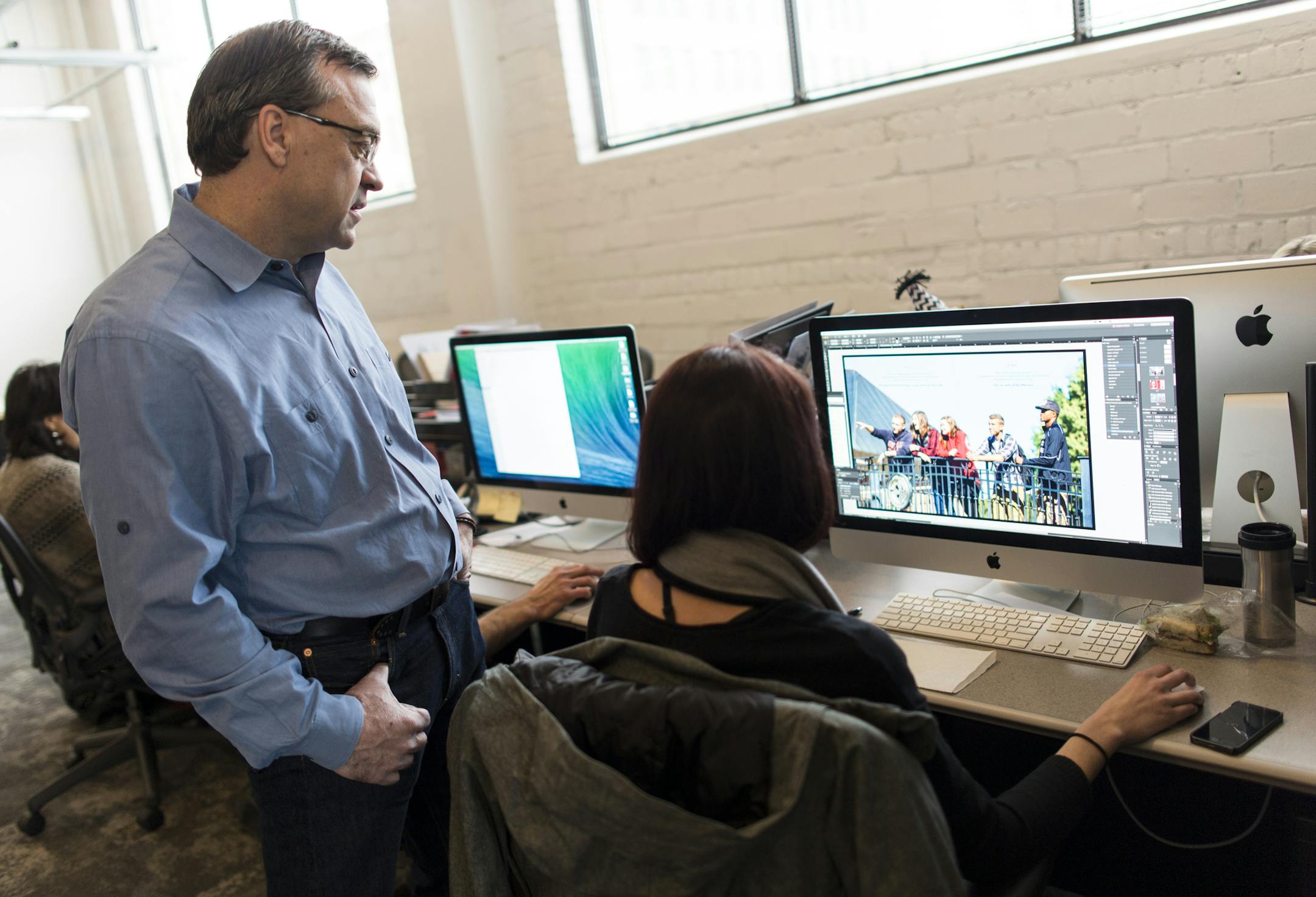 Thorburn Group COO Pat Weas consulted with designer Taylor Gottschalk as she worked on Central College's view book.