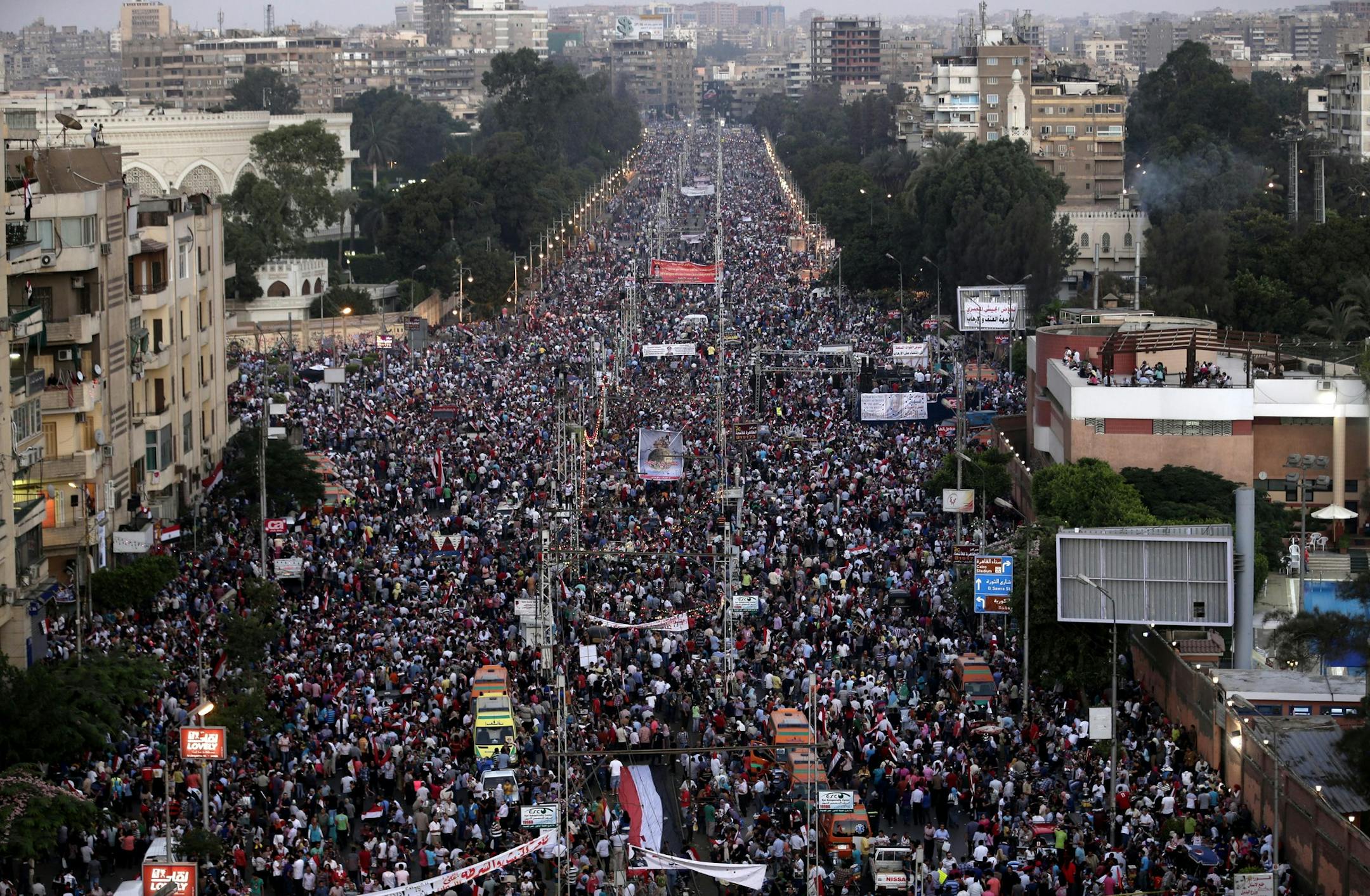 Egypt's ousted President Mohammed Morsi protest at the presidential palace in Cairo, Egypt, Friday, July 26, 2013. Prosecutors opened an investigation of ousted President Mohammed Morsi on charges including murder and conspiracy with the Palestinian militant group Hamas, fueling tensions amid a showdown in the streets between tens of thousands of backers of the military and supporters calling for the Islamist leader's reinstatement.(AP Photo/Hassan Ammar)