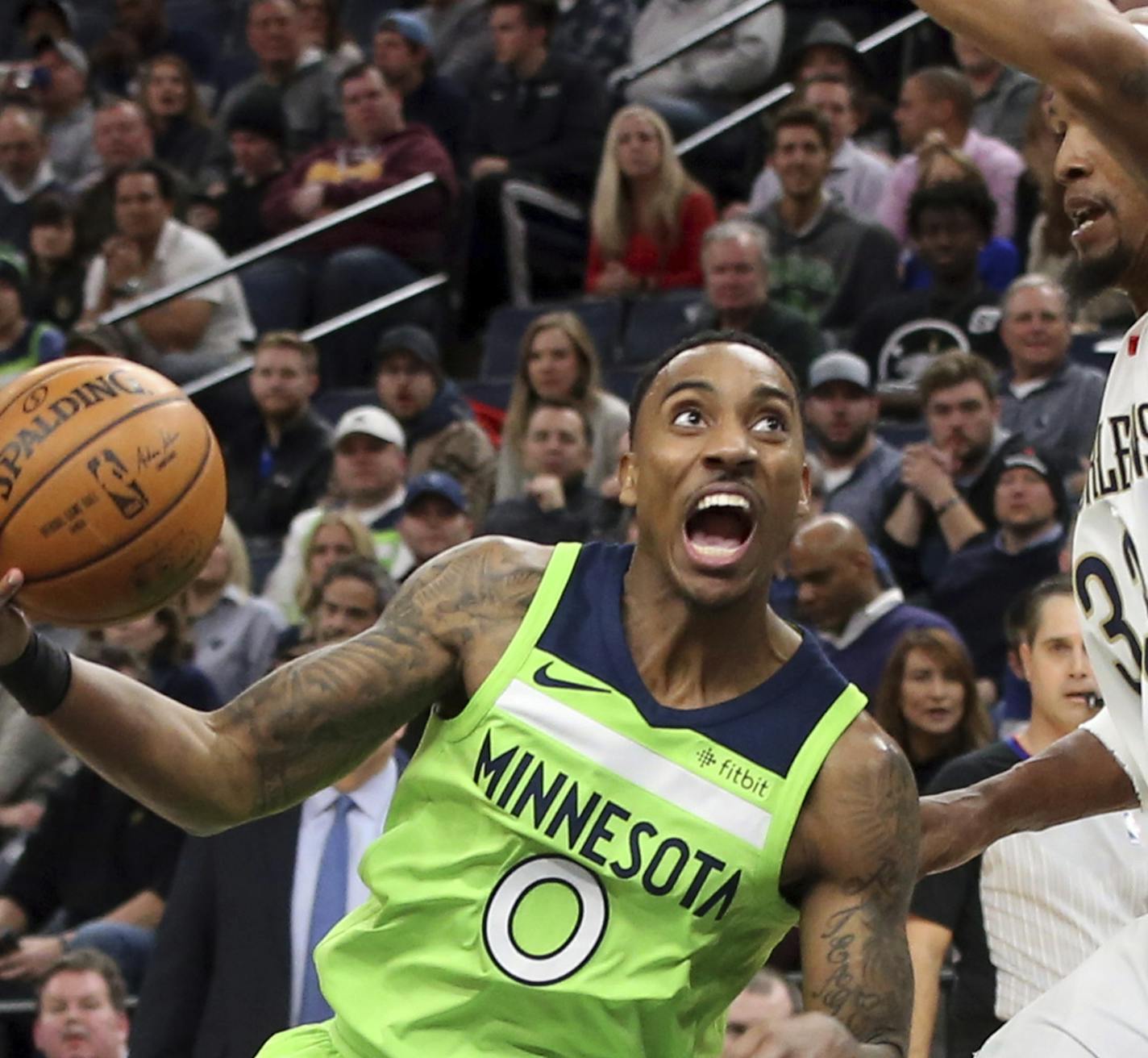 Minnesota Timberwolves' Jeff Teague, left, drives around New Orleans Pelicans' Dante Cunningham in the first half of an NBA basketball game Saturday, Feb. 3, 2018, in Minneapolis. (AP Photo/Jim Mone) ORG XMIT: MIN2018020321051069