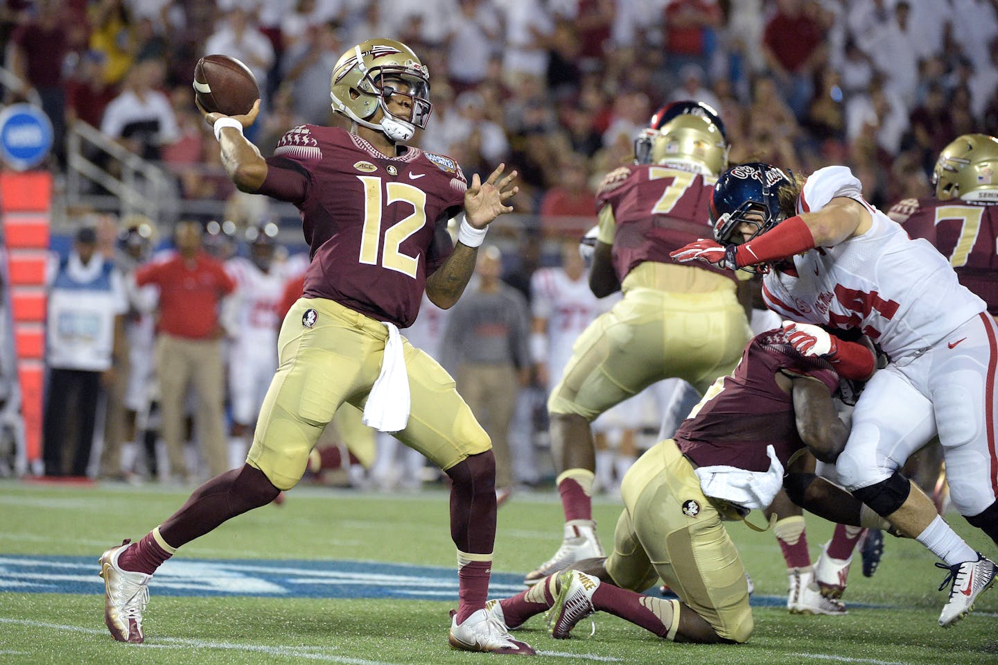 Florida State quarterback Deondre Francois threw a pass as he was rushed by Mississippi linebacker Alex Ashlock (44) during the first half Monday in Orlando, Fla.