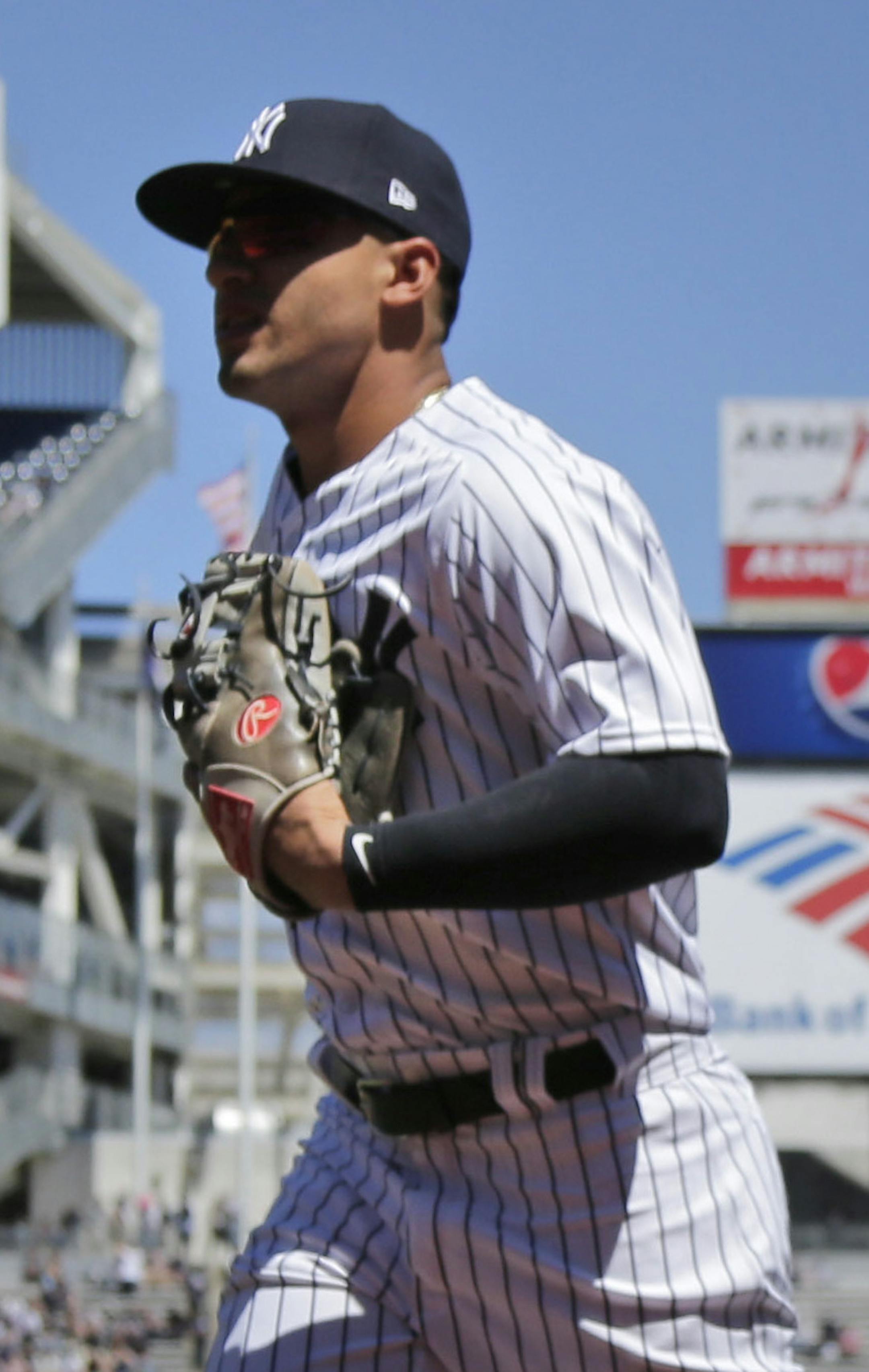 New York Yankees' Gleyber Torres warms-up before the baseball game against the Toronto Blue Jays at Yankee Stadium Sunday, April 22, 2018 in New York. (AP Photo/Seth Wenig)