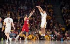 Gophers guard Tre' Williams attempted a three-pointer over Nebraska guard Haanif Cheatham in the second half of Minnesota's 107-75 victory at Williams
