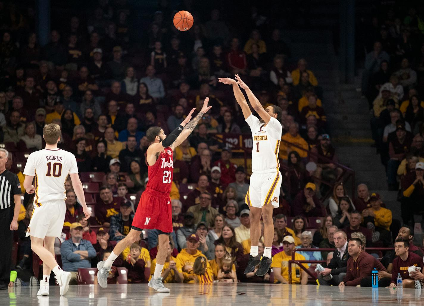 Gophers guard Tre' Williams attempted a three-pointer over Nebraska guard Haanif Cheatham in the second half of Minnesota's 107-75 victory at Williams Arena on Sunday. The Gophers made a team-record 18 three-pointers in the game.