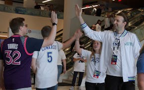 Timberwolves fans high-fived each other as they prepared to settle in for Game Six against Denver on Thursday night.